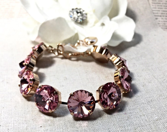 Stunning instant glamour romantic elegance pink genuine Swarovski crystal large stone bracelet in rose gold. 14 mm rivoli crystal stones.