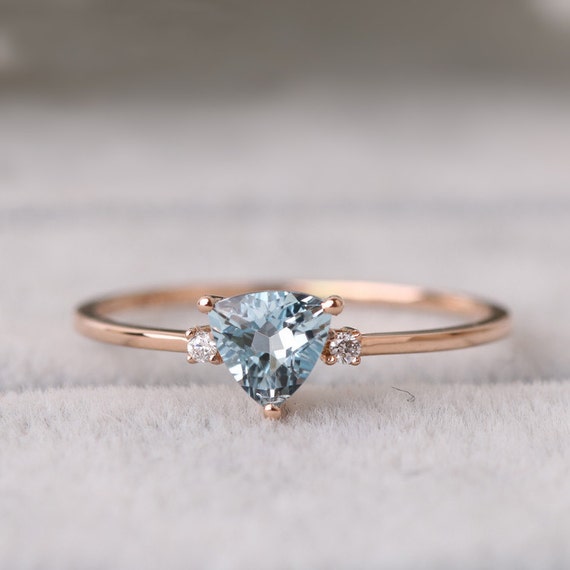 Sale Trillion-cut aquamarine ring in solid 18k rose gold on a