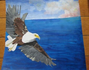 Eagle flying over water