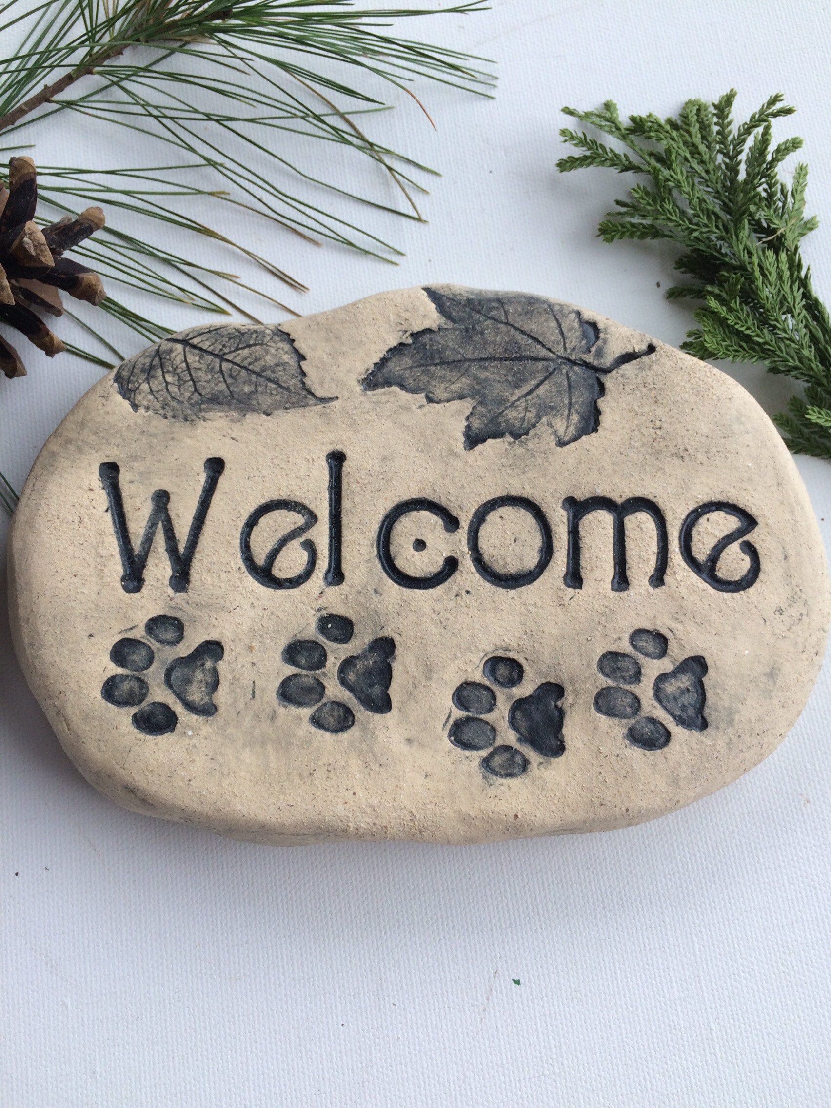 sign with dog paw prints. Handmade ceramic plaque.