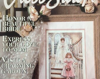 Started Paula Vaughan 'The Bride' cross stitch with some supplies