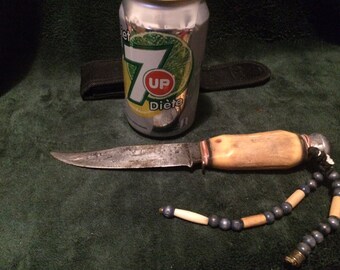 Very old hunting knife with bone handle