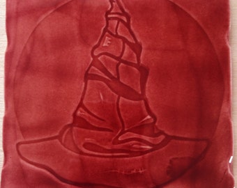 Handmade 'Wizards Hat' design tile In Claret colour glaze,