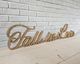 Fall in love sign. Love gold sign. lovely home decoration. Standing sign or a wall decor sign, romantic saying, love