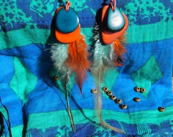 Earrings handmade with feathers and coloured seeds