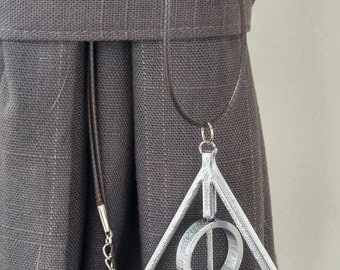 Spinning deathly hallows necklace