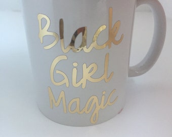 Metallic Gold Black Girl Magic white ceramic mug.