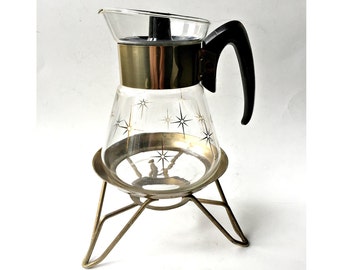Corning Coffee or Tea Carafe with Warming Stand. Atomic Starburst Coffeepot with Brass Cradle.