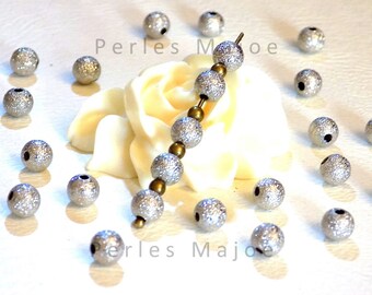 Lot de 20 perles stardust rondes en laiton couleur platine diamètre 6 mm