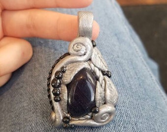 polymer clay pendant with purple goldstone