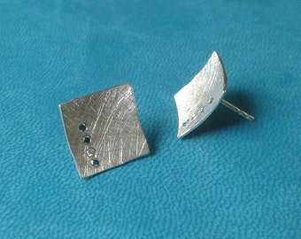 Silver earrings with blue and white diamonds