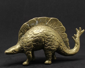 brass dinosaur figurine