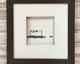Pebble Art by Sharon Nowlan, sea glass clothesline and whale pebble art comes matted or framed in 12 by 12 frame.