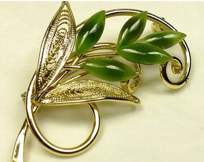 Storewide 25% Off SALE Beautiful vintage 2" goldtone and jade brooch featuring a swirling stem and openwork leaf design with marquis jade st