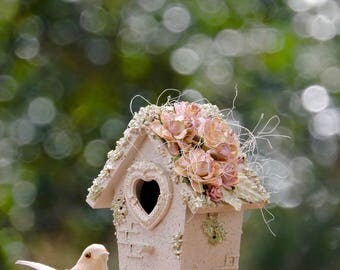 Decorative light green birdhouse