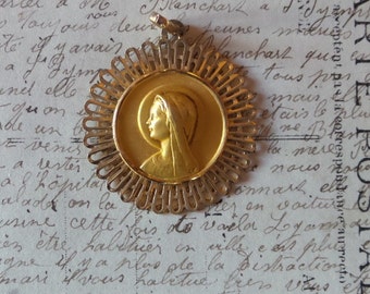 Vintage golden metal French Virgin Mary Medal. Religious pendant.