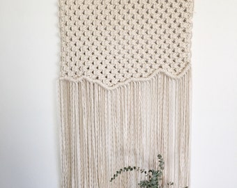 Macrame wall hanging on driftwood