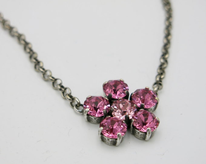 Pink flower genuine Swarovski crystal pendant necklace on a rolo chain with a lobster clasp.