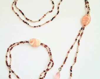 Peach and brown overhead necklace and bracelet.