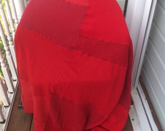 Handmade soft red wool patchwork throw blanket. Bedding. Sleep.
