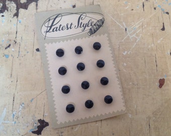Vintage 'Latest Style' card with 12 black buttons