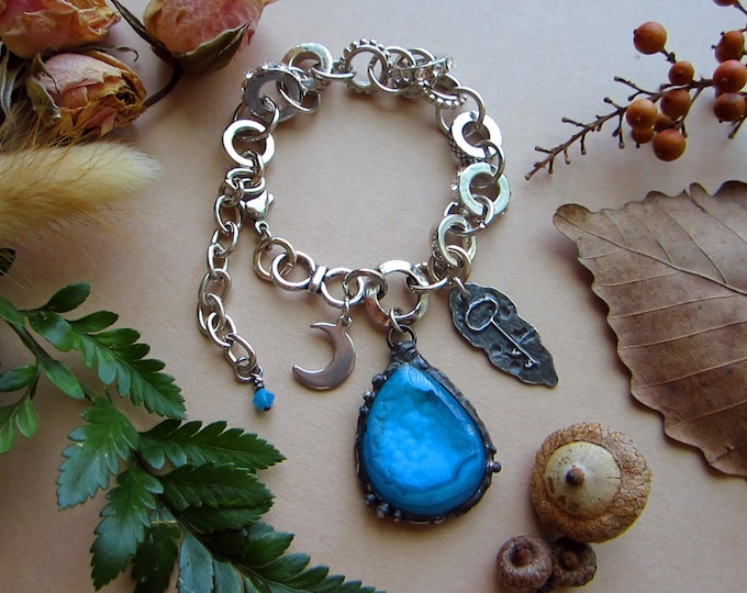 Adjustable size chunky bracelet with blue Druzy Agate, crescent moon charm, rustic key charm, and tiny Swarowski crystal. Total length 9.5".