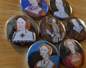 The Six Wives of Henry VIII - a set of 7 25mm button badges featuring the matrimony mad monarch and his many missuses!