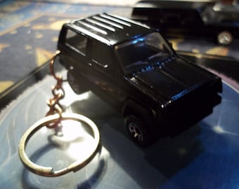 custom made very rare keychain 1984 to 1990 jeep cherokee xj,gloss black w/black grill-bumpers-chrome mags/repaint-mint