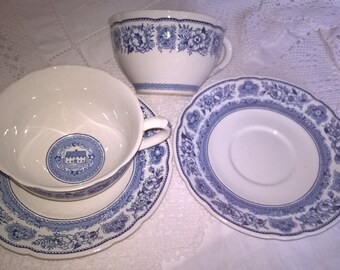 Pair of Wedgwood Yale cups and saucers. Inside the cup is the Branford Founders house, 1701. Cup and saucer rims have a floral pattern.