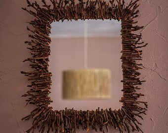 Wall mirror with cherry branches from prune