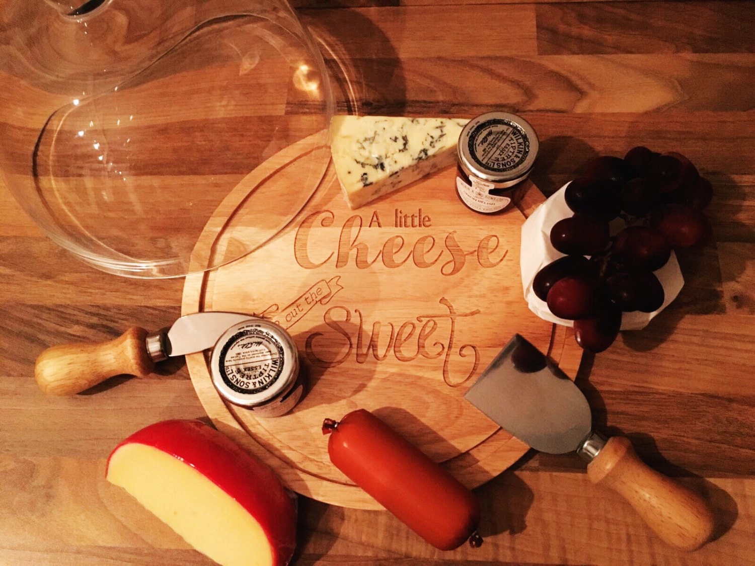 Cheese board and cover with knives a little cheese to cut the