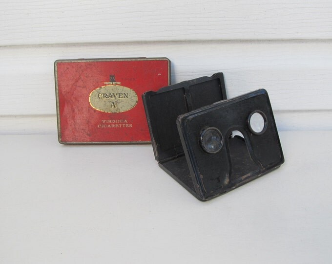 Folding stereoviewer, stereoscopic image viewer, vintage metal optical stereo viewer in Craven A Virginia Cigarettes tin box