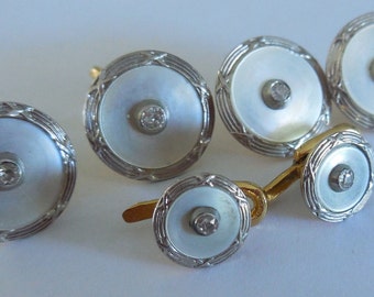 Cuffs + collar buttons. Diamonds, gold, Platinum, mother of Pearl
