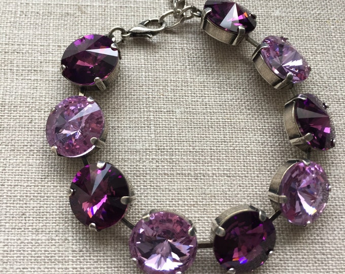 Powerfully sparkly light and dark purple amethyst Swarovski Crystal bracelet with 9 large 14mm rivoli stones. Bridesmaid wedding jewelry