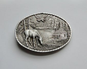 1985 Indiana Metal Craft Solid Pewter Mountain, Eagle Horse, Cabin Scene Belt Buckle.