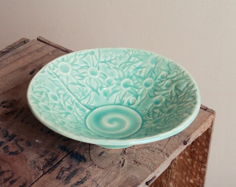 Stoneware bowl in teal glaze with Australian Flannel Flower design