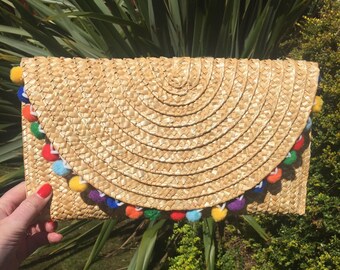 Pom-pom straw clutch