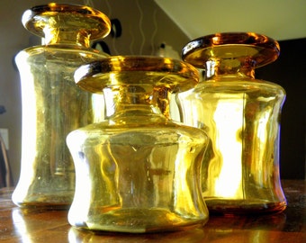 Trio of Mid Century Dansk (France) Amber Glass Vases/Candle Holders--Jens Quistgaard Design--Large = 6-1/4" H / Medium=5" H / Small=3-1/2" H