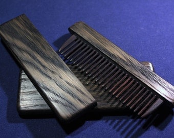Wooden comb in the case of bog oak (2000 years old) Age of Christ