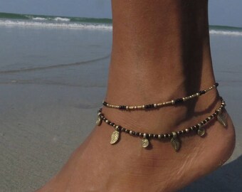 Double-rowed ankle bracelet with pearls and brass spirals