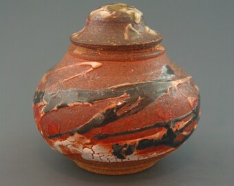 Covered Jar, wood-fired stoneware w/ crawling shino, tenmoku, celadon and natural ash glazes