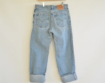 Women's Levi's jeans Size 11 Junior Guy's Fit Vintage 90's Era Light faded Wash 33" waist 41" hips