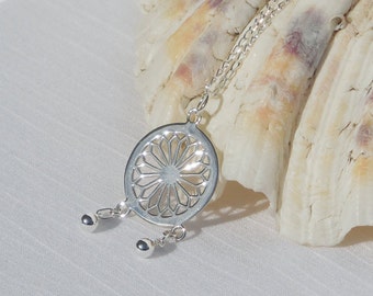 Large sterling silver pendant on a sterling silver chain