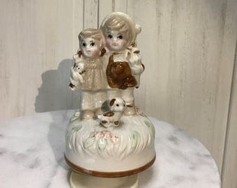 vintage music, boy and girl and their cute dog, working music box, plays raindrops keep falling on my head, adorable