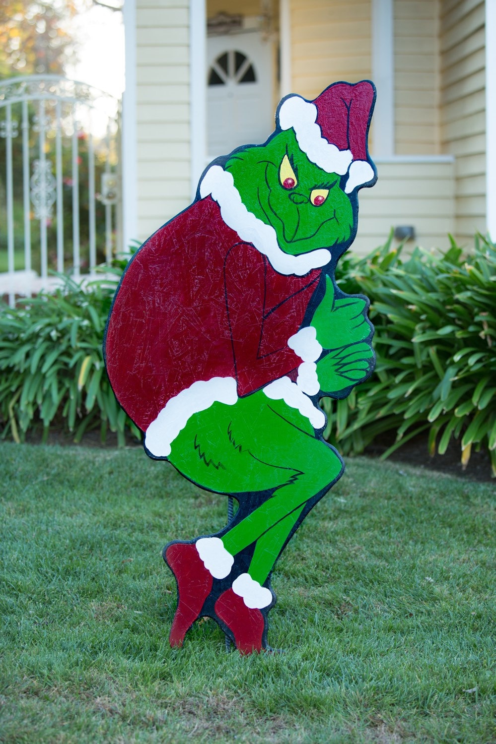 Grinch stealing Christmas lights by HolidayLawnCutouts on Etsy