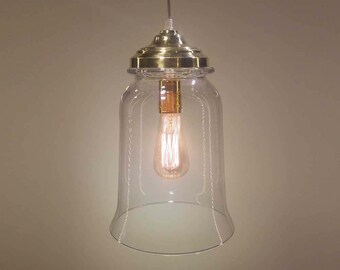 Glass pendant lighting fixture with gold brass canopy. Hanging light for kitchen isle. Glass shade with gold brass canopy and ceiling canopy