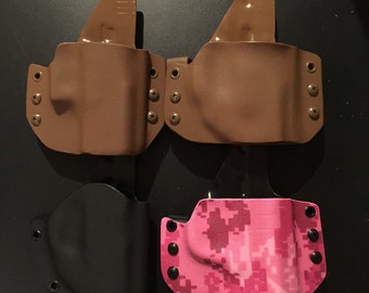 Outside the waistband custom holster for compact handguns.