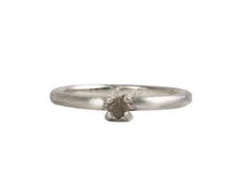 silver ring with a rough diamond cube