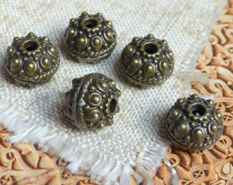 4 large Moroccan bronze beads