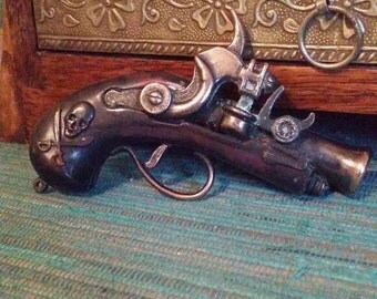 Vintage toy pirate cap gun, die cast